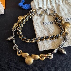 Louis Vuitton Two-Tone Gold & Silver Bag Charm with Black Leather Weave.